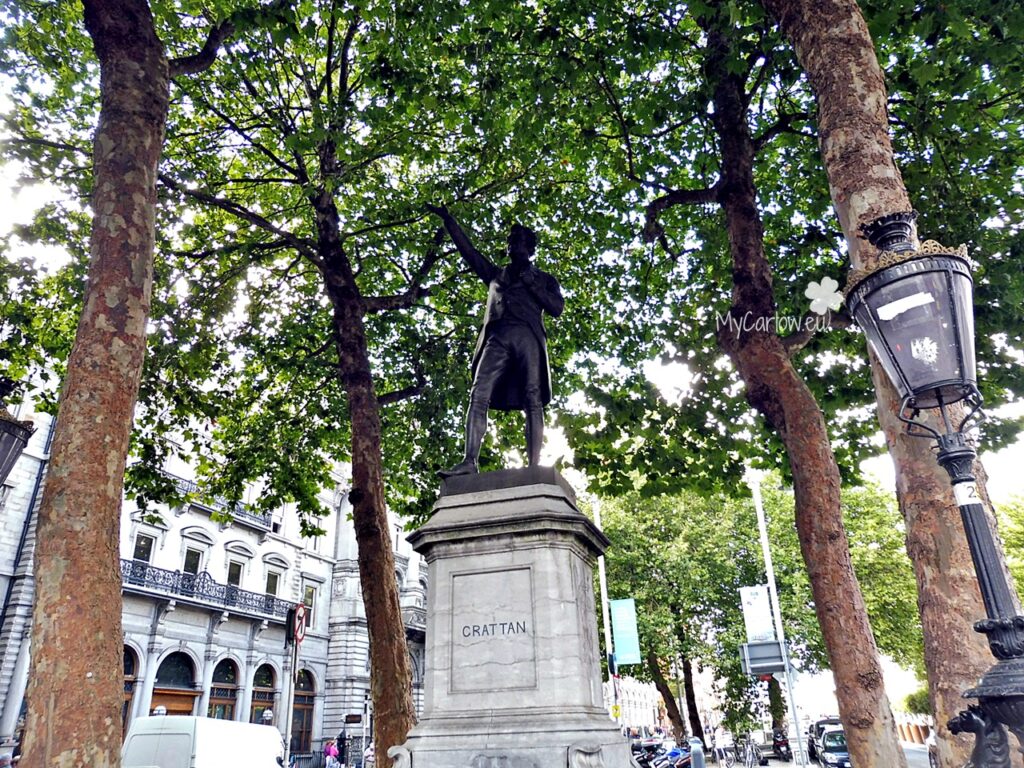 The Statue of Henry Grattan - located on the traffic island to the center of College Green facing Trinity College.